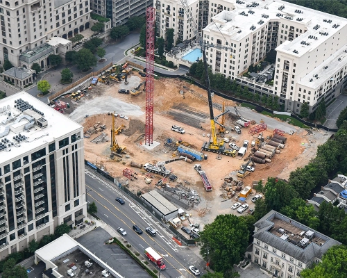 Aerial view of Elyse Buckhead construction site with cranes and surrounding buildings.
