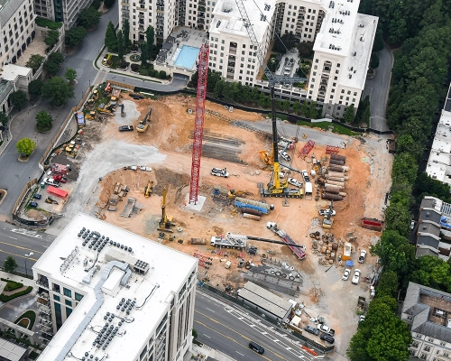 Central crane view of Elyse Buckhead construction progress and foundation work.
